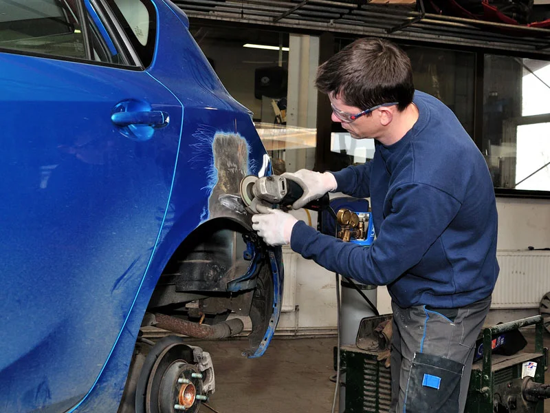 Certified Technician working on car at Auto Body Shop in Tampa FL