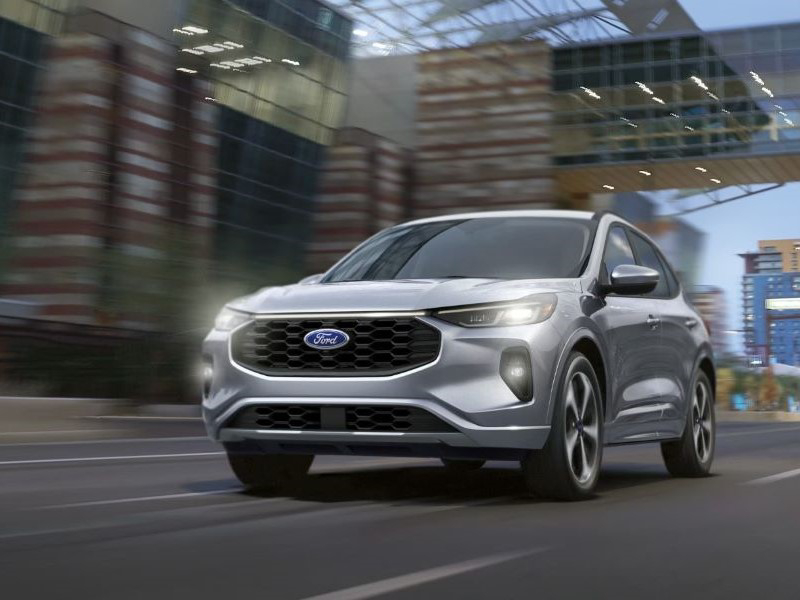 Ford Escape driving through the city with motion blur from Ford Dealer near East Lake-Orient Park FL