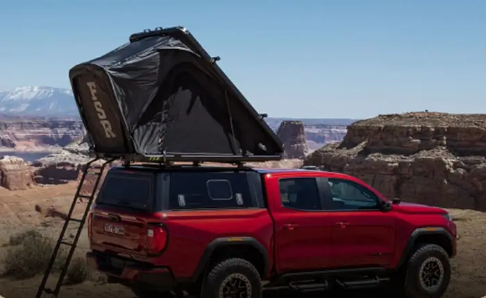 GMC pickup with a rooftop tent