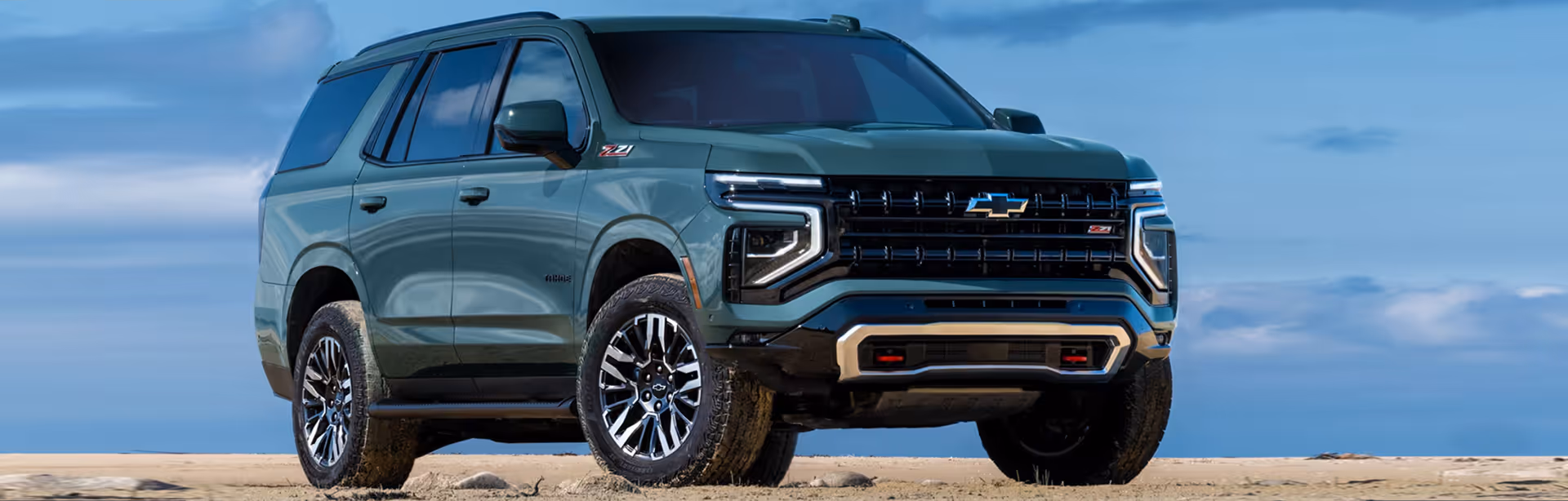 2025 Chevrolet Tahoe parked in a field