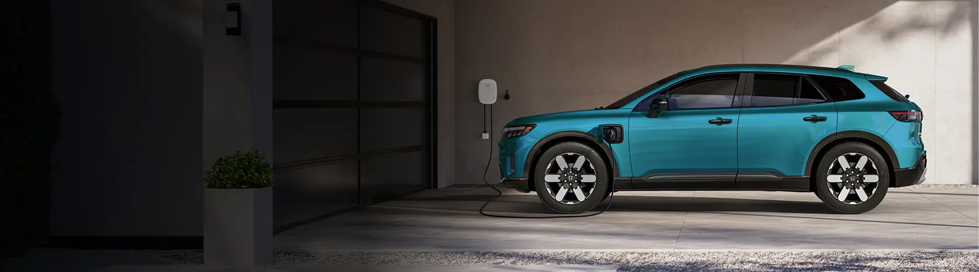 Honda Prologue parked in a garage using the home EV charger