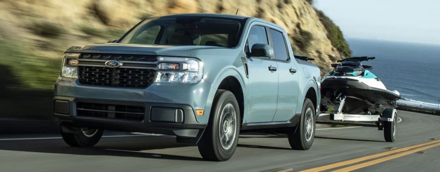 Blue 2022 Ford Maverick towing jetskis