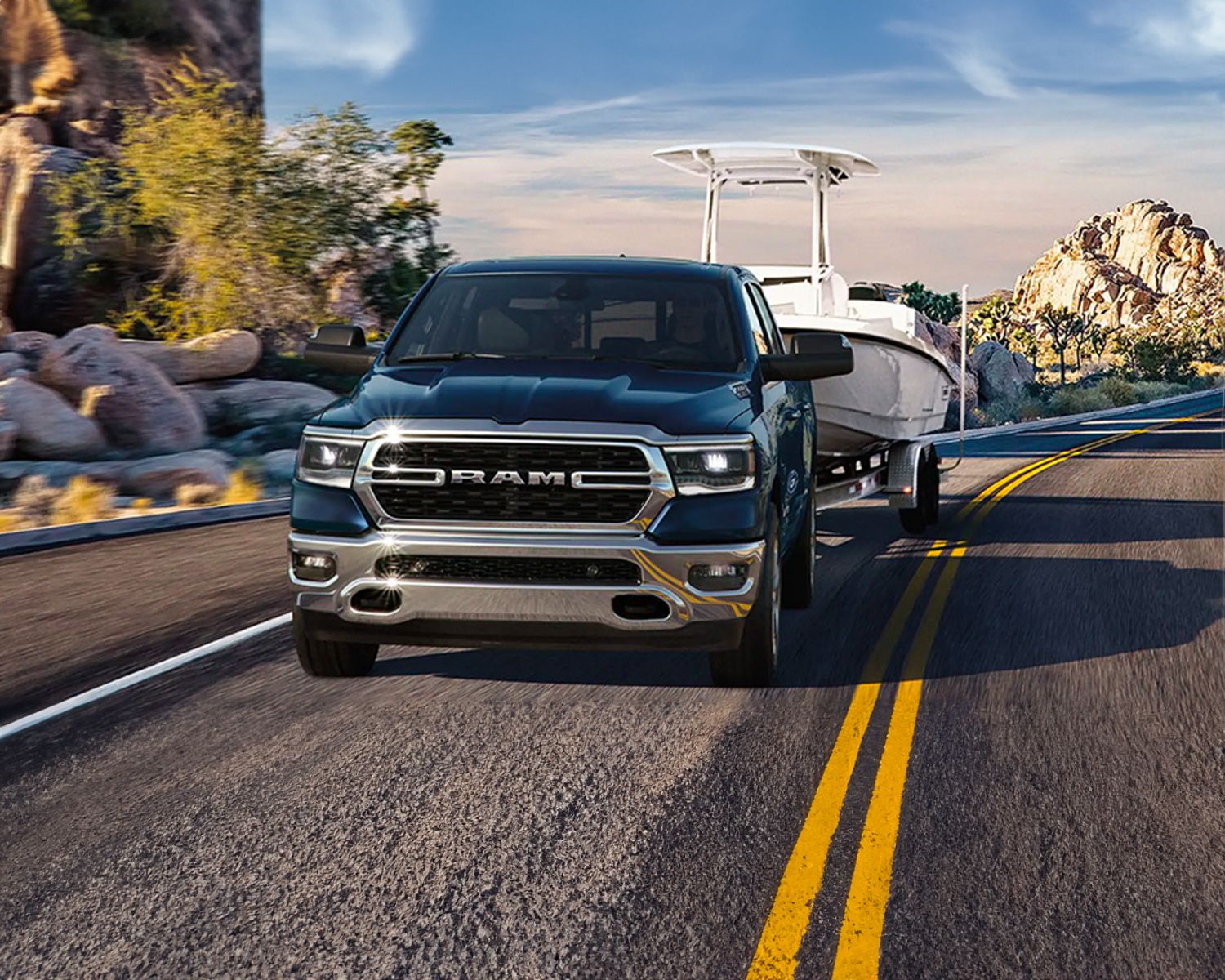 2023 Ram 1500 towing a boat on a road