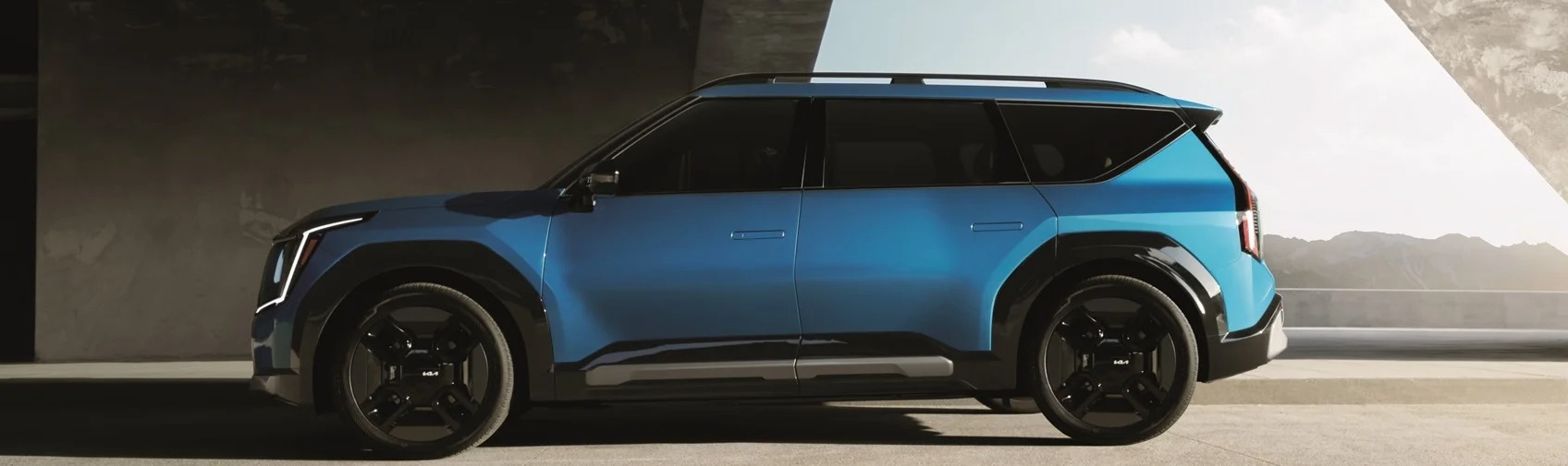 Blue Kia SUV Parked with a Sideview