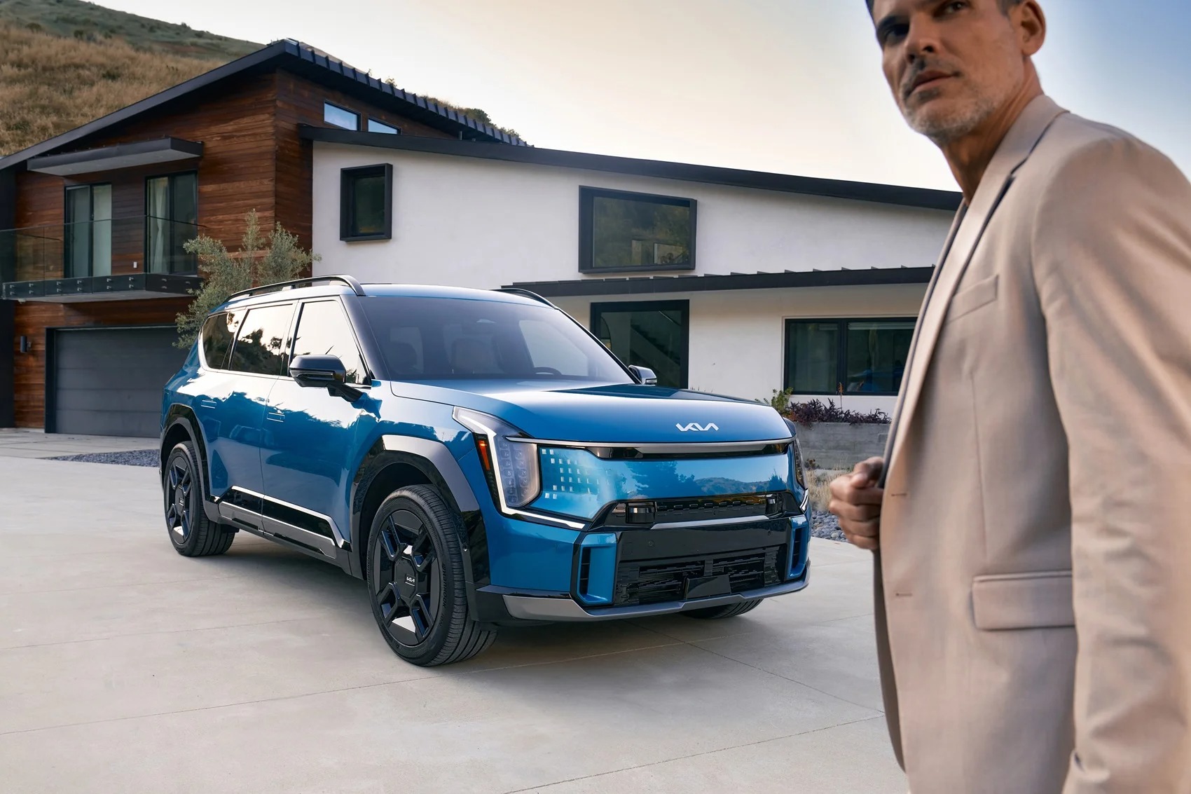 Blue Kia SUV Parked in a Driveway