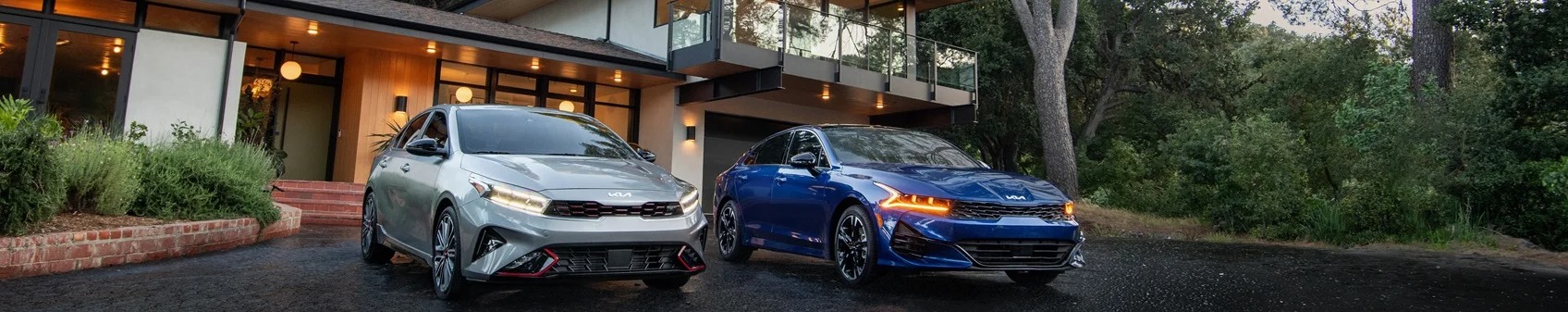 Kia Sedans Parked in a Driveway