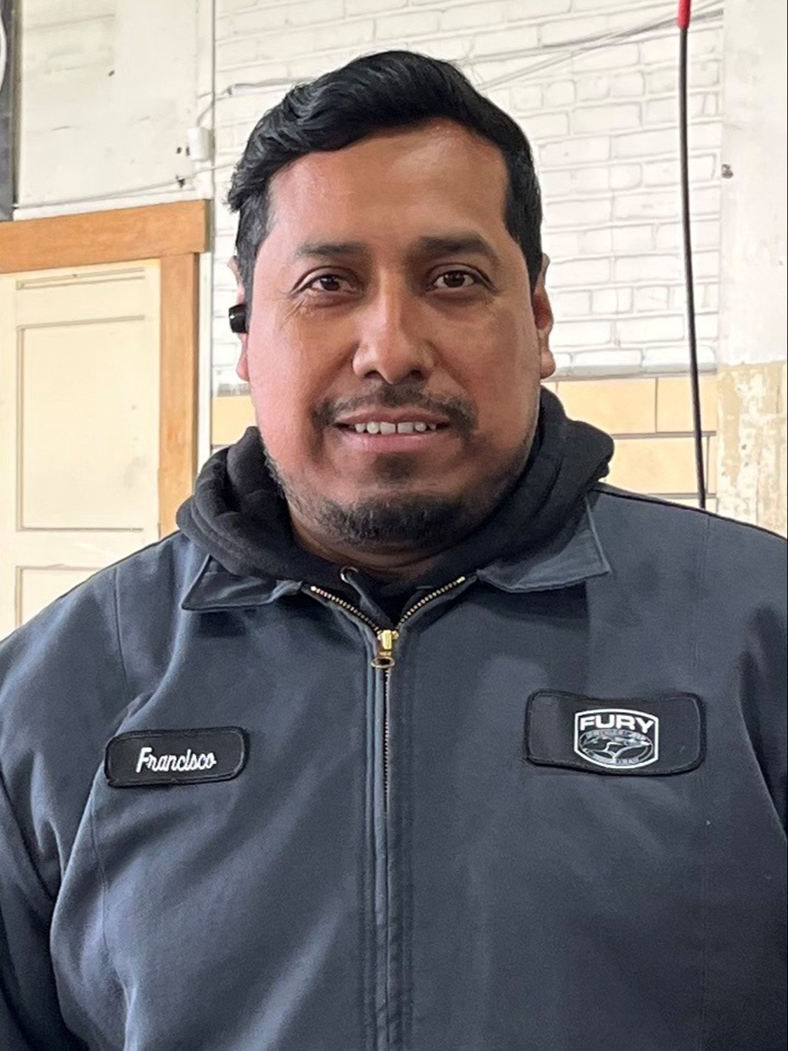 Detailer Francisco Alcaraz in Body Shop at Fury Motors Saint Paul CDJR