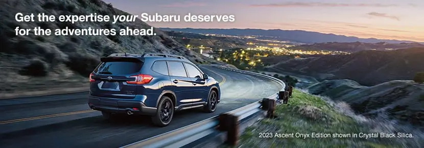 2023 Subaru Ascent Onyx Edition in Crystal Black Silica driving on a mountain road